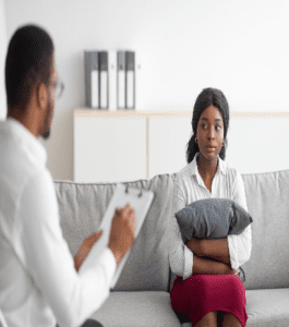 A man and woman sitting on the couch